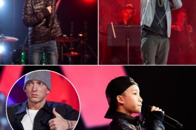 Just 12 years old, a shy Asian boy walked onto The Voice stage, gripping the microphone like it was his only anchor. With a soft voice, he shared how Eminem’s music had been his lifeline through years of bullying. Then the beat dropped. Within seconds, his voice exploded with fire and fearless energy. The judges were stunned—chairs turned in unison, eyes wide in disbelief. The crowd rose to their feet, clapping, cheering, crying. In that moment, a star was born.