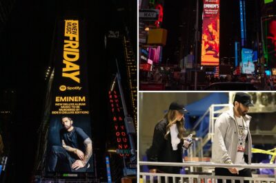 Spotify celebrates the 25th anniversary of The Marshall Mathers LP with a bold tribute at Times Square, featuring a new album cover inspired by this iconic image. Fans spot Eminem dressed casually, secretly visiting to take photos with his commemorative display