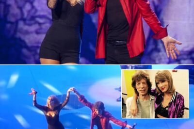 The crowd didn’t cheer—they fell into stunned silence as Taylor Swift stepped into the spotlight beside Mick Jagger on that unforgettable Chicago night; no flashy entrance, no vocal showboating—just a haunting stillness as two generations locked eyes, their voices weaving a rock ballad from the ’60s into something achingly timeless, as if the torch was being passed not with fireworks, but with a whisper that echoed straight through music history.