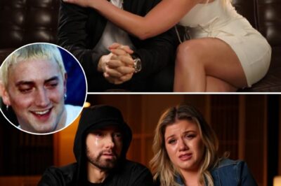 In a surprise drop that hit like a punch to the chest, Eminem and Kelly Clarkson teamed up in 2025 for “Scared to Lose” — a raw, gut-wrenching power ballad that blends Em’s unfiltered emotion with Kelly’s soul-stirring vocals. This wasn’t just a song; it was a confession. Eminem strips away the mask, rapping, “Every time I laugh, I think it’s the last / Like joy’s just a loan that life takes back fast / I ain’t scared of the dark, but I’m scared of goodbye / ‘Cause I’ve buried too much to not wonder why.” Fans are calling it his most vulnerable track since “Mockingbird” — and honestly, it feels less like a comeback and more like a cry from the heart.