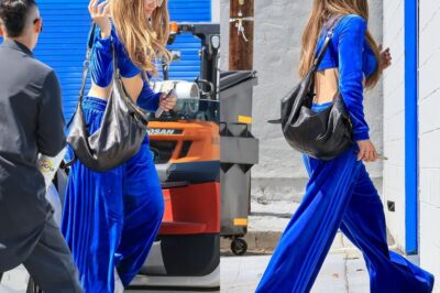 Jennifer Lopez shows off her figure in cropped velvet tracksuit and sky-high platform sneakers