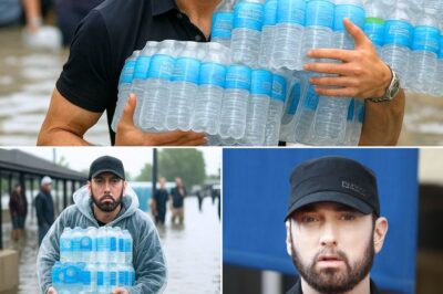 Eminem Carries 58 Cases Into Flood Shelter, Refuses Help from Anyone Under 60 — Hours Later, What They Found on the Floor Left Everyone Stunned and in Tears!He said just one thing: “Let the young ones rest.” And with that, Eminem — drenched in sweat and rain — began unloading 58 cases of bottled water into a flooded Texas shelter. Volunteers begged to help. He refused. No cameras. No spotlight. Just silent determination. But hours later, a chilling sight brought the shelter to a standstill. A volunteer found him collapsed on the floor beside an empty cooler, hand still gripping the final case — asleep, exhausted, and barely breathing. No words. No press. Just a quiet act of compassion that’s now being called the most human moment of his career. People aren’t just stunned — they’re emotional. And the mystery of what happened next… is leaving the internet in tears.