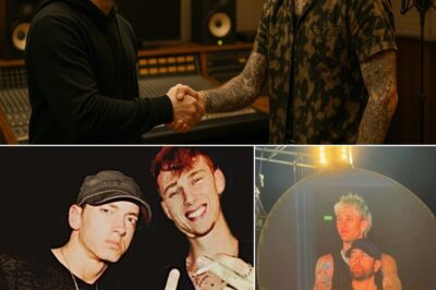 No One Could Have Imagined It, Yet There They Were, Eminem And Machine Gun Kelly, Two Of The Most Ruthless Rivals Hip-Hop Has Ever Seen, Standing Side By Side In A Secret Recording Studio, Laughing Like Old Friends And Announcing A Joint Album That Industry Insiders Are Calling “The Biggest Shock Of The Decade,” A Collaboration So Unthinkable That Even Their Closest Circles Were Left Speechless, As Rumors Swirl About Late-Night Meetings, Million-Dollar Deals, And A Mysterious Producer Who Reportedly Forced Them To Bury The Hatchet, Leaving Fans Worldwide Stunned, Confused, And Desperately Wondering If This Explosive Partnership Will End In Musical Genius Or Absolute Chaos