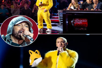 Slim Shady PULLS THE ULTIMATE PRANK: hiding under the “Golden Fox” mascot suit, rapping like a stand-up comedian, freezing the entire Masked Singer stage! Then the mask comes OFF — surprise, it’s Eminem, the rap god fans only dared dream about! The internet collapsed, fans were both shocked and cracking up: “That fox’s got comedy chops now!” Only Slim could pull off the sneakiest disguise in showbiz history!