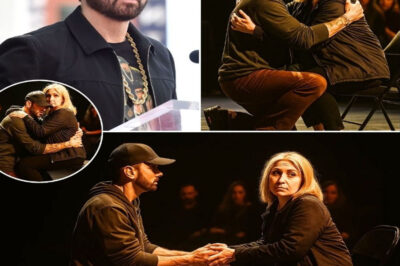 DETROIT SHOCK! At the Detroit Music Awards at Ford Field, Eminem suddenly choked up mid-speech when he spotted a woman who looked exactly like his late mother. He then pulled out a mysterious object from his wallet that he had kept for decades and handed it to her. The audience fell silent, then burst into tears — and fans were left wondering, “Is the Rap God about to call it quits?”
