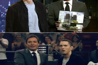 When Jimmy Fallon touched down in Motor City for his Detroit Opera House taping, the question was simple but the answer set the crowd buzzing, asked what comes to mind when he hears “Detroit” he skipped hesitation and fired back with Motown, cars, Ford—then dropped the name Eminem like a spark in the night, fans instantly whispering about a surprise stage reunion, memories of Em’s past Tonight Show appearances flashing through social feeds, the air thick with anticipation that Slim Shady might crash the party, but instead he slipped quietly to the Lions game while Fallon held the city’s spotlight, leaving everyone wondering if the ultimate Detroit crossover was just a heartbeat away.