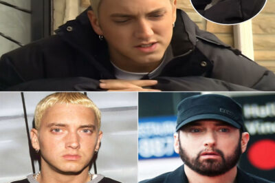 Eminem stood where it all began — the cracked pavement, the flickering streetlights, the sound of distant sirens echoing through Detroit’s cold night. In 1999, Eminem returned to the city that built him and nearly broke him, standing in front of the same corner store where he once dreamed with empty pockets and endless rage. Going Back, filmed by MTV News, wasn’t just an interview — it was a reckoning. You could see it in his eyes: the pride, the pain, the ghosts of every verse he’d ever written in the dark. And as the cameras rolled, it wasn’t the superstar speaking anymore — it was Marshall Mathers, face to face with the boy he left behind.