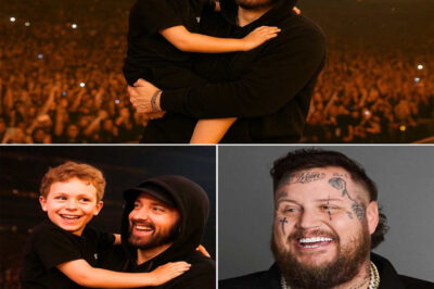 “DETROIT ERUPTS INTO CHAOS! Eminem CRASHES Jelly Roll’s Concert With His Grandson — Then Drops a SHOCKING, GAME-CHANGING REVELATION That Sends Fans SCREAMING, Hip-Hop Spinning, and the Entire Arena Into Absolute PANDEMONIUM!!Detroit didn’t just get a surprise — it got a seismic moment no one saw coming. The crowd went feral when Eminem stormed the stage mid-show, but the arena exploded when his grandson stepped forward and unleashed bars with uncanny Shady fire. Fans were screaming, cameras shaking, and everyone knew they were witnessing something historic. Then Em paused, leaned into the mic, and delivered a revelation about the boy’s future that sent shockwaves across the entire hip-hop world. One night. One stage. One legacy reborn — and Detroit is still trembling.