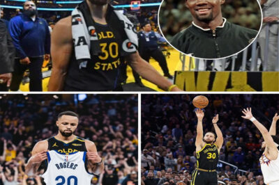 SILENT ROAR AT THE ARENA: As soon as Stephen Curry’s three-pointer went through the net, the entire arena—already ablaze with intense action—suddenly fell silent, as if someone had muted the entire arena. Tens of thousands of spectators stood up at once, not a single cheer, just a sea of ​​hands on their chests. At baseline, a small photo of Rodney Rogers was illuminated at the exact moment Curry turned around, touched his chest, and raised three fingers toward the stands in a long-prepared ritual. What gave the audience goosebumps was the detail of Curry retreating to his own court without smiling—his eyes red, his head bowed slightly, and his teammates behind him also stopped, no one running to celebrate even though this was the most important shot of the game. A slow-motion angle also showed his father, Dell Curry, wiping his eyes in the stands, while the LED board above displayed a message that appeared for just four seconds: “For Rodney.” Without words, without announcement, with just one throw and a few small movements, Curry turned an entire chaotic arena into a breathtakingly beautiful moment of remembrance.