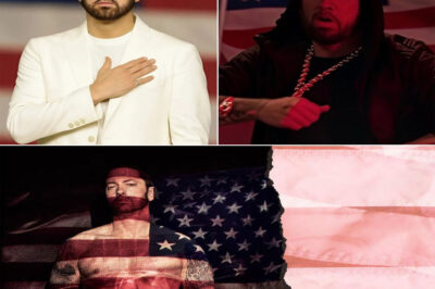 BREAKING NEWS: Eminem Did Something Last Night No One Expected — and Everyone Will Remember 🇺🇸 It started like any other high-energy concert in New York City — lights flashing, beats pounding, the crowd roaring. But halfway through the show, everything changed. A few voices in the audience began shouting angry, anti-American remarks. The tension was thick, but Eminem didn’t walk off stage or fire back. Instead, he stood still, gripped the mic, and took a deep breath. Then, in a voice soft but steady, he began to rap the words to “God Bless America.”