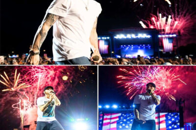 EMINEM STOPS EVERYTHING — JULY 4TH PERFORMANCE ERUPTS INTO SHOCKING SILENCE AS HE LOCKS EYES WITH THE ONE MAN HE’S AVOIDED FOR 25 YEARS: ‘TONIGHT… THIS IS FOR YOU.’ THE CROWD FROZE. THE INDUSTRY IS STILL SHAKING! Nobody was ready. One moment, Eminem was tearing through his Independence Day set with the fire and precision only he can bring. The next, he threw up a hand—and the entire arena fell dead silent. The beat cut. The lights dimmed. And in the haze of fireworks behind him, Marshall Mathers fixed his eyes on a single man standing near the barricade… a man he hadn’t faced in twenty-five years. No words. No warning. Just a stare heavy enough to stop 50,000 people from breathing. Then came the line nobody will ever forget: “25 years I’ve said nothing. But tonight… this is for you.” What followed wasn’t a diss, wasn’t an apology—it was something deeper, older, and more explosive than anyone expected. When Eminem let the microphone drop and the thud echoed across the stadium, the world knew they had just witnessed the moment he’d been running from for decades. The silence? It said everything.