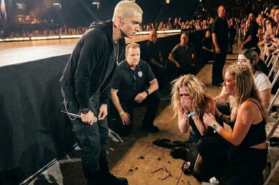 BREAKING NEWS: Eminem Halts Concert as Fan Collapses in the Crowd-A Heartfelt Moment Captured Live on Stage